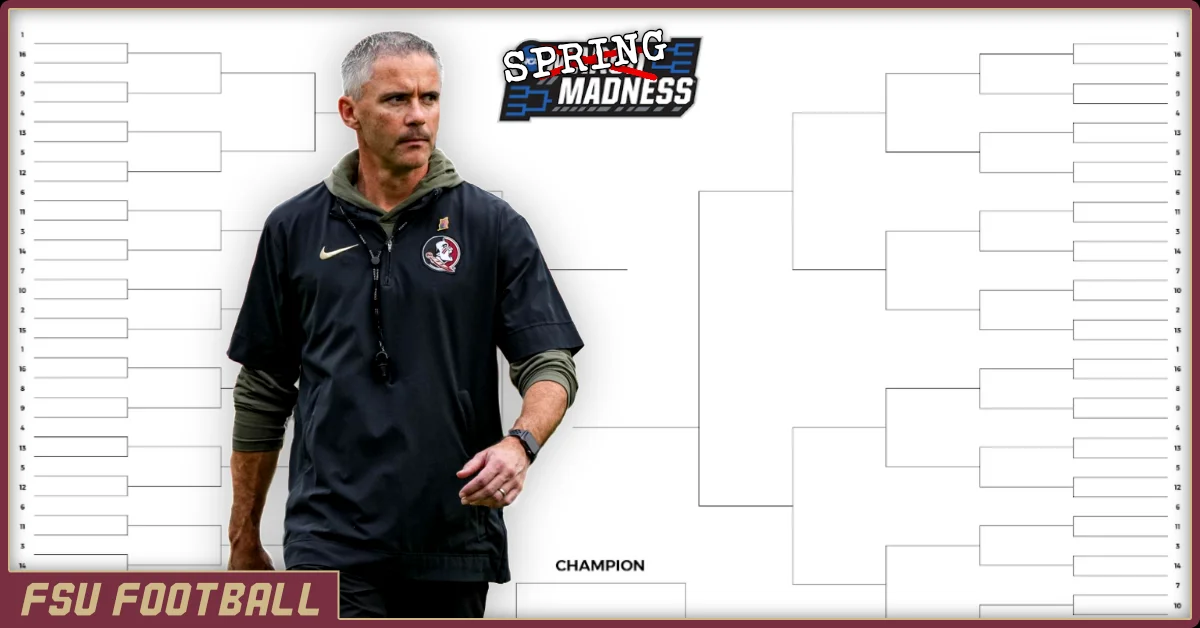 Mike Norvell in front of a March madness bracket